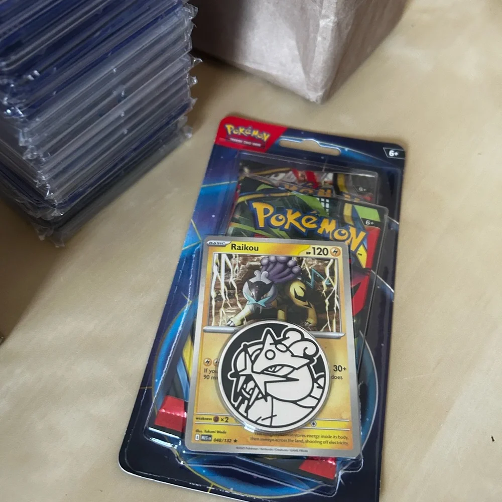 Lot of 10 Pokémon TCG booster double pack with two packs inside featuring Raikou